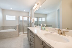 Combined shower/tub, hair dryer, towels, soap