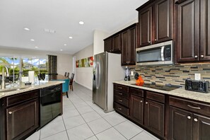 Fridge, microwave, oven, stovetop - Picturesque Home with Theme Rooms, Theater and Game Room near Disney with. (Reunion)