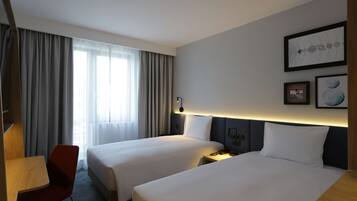 Hypo-allergenic bedding, down duvets, in-room safe, desk