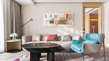 Deluxe Suite, 1 King Bed | Living area | 50-inch LCD TV with satellite channels, TV, pay movies