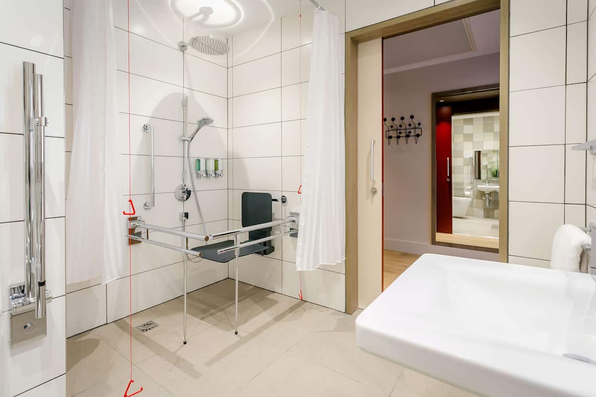 room, 1 queen bed, accessible | bathroom shower