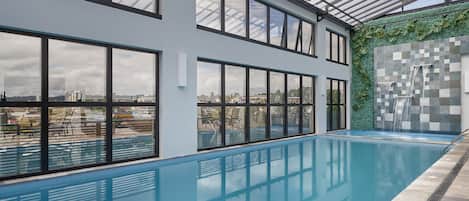 Indoor pool, open 9:00 AM to 10:00 PM, pool loungers