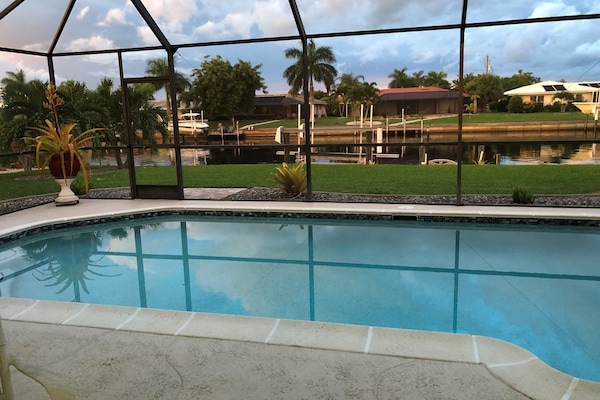 Gorgeous saltwater pool view overlooking an extra wide canal for added privacy.