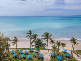 Private beach, white sand, sun loungers, beach umbrellas