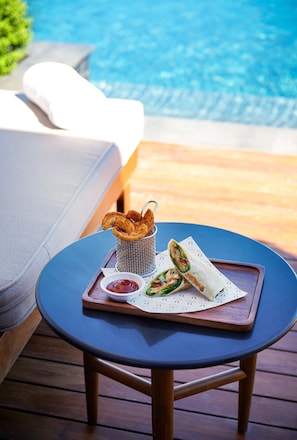 Outdoor pool, open 7:00 AM to 7:00 PM, pool umbrellas