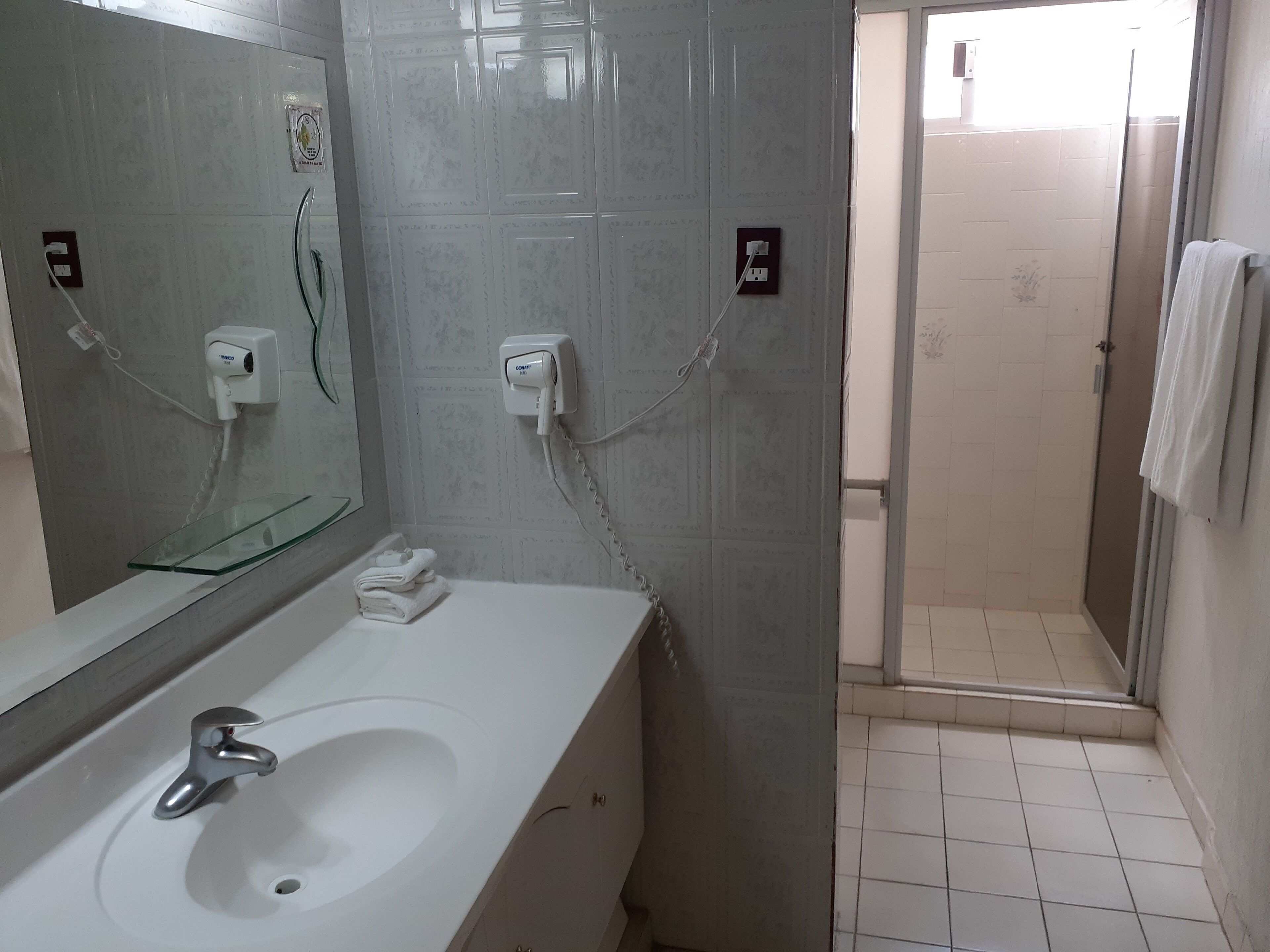 shower, free toiletries, hair dryer, towels