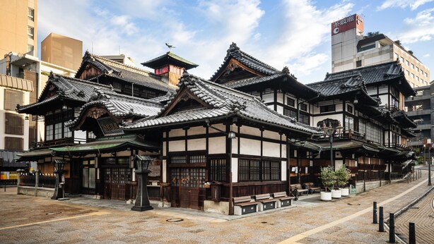 A traditional Japanese building with multiple gabled roofs and wooden structures. - Comfort Hotel Matsuyama (Matsuyama)
