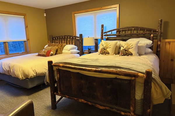 Two queen beds on upper level.