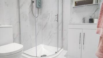 Shower, hair dryer, towels, soap