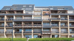 A multi-story residential building with balconies, large windows, and a flat roof. - Le Britannia by Interhome (Carnac)