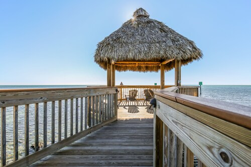 Coastal retreat with private balcony, pool, & easy beach access