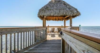 Coastal retreat with private balcony, pool, & easy beach access