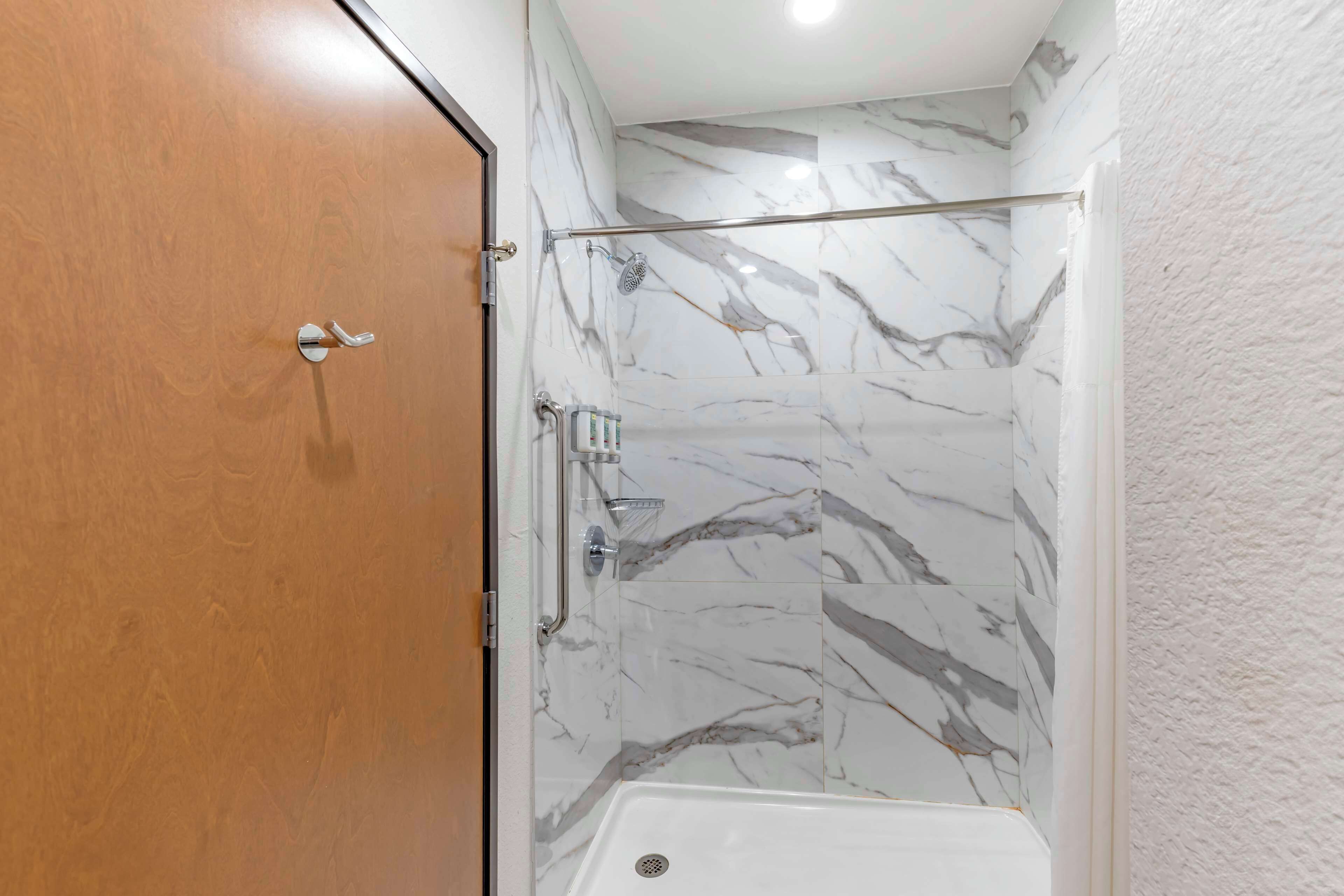 standard room, 1 king bed, non smoking, refrigerator & microwave | bathroom | towels