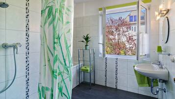 Bathtub, hair dryer, towels