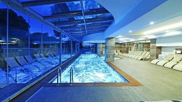 Indoor pool, outdoor pool, open 9:30 AM to 6:30 PM, pool umbrellas