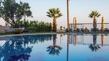Indoor pool, outdoor pool, open 9:30 AM to 6:30 PM, pool umbrellas