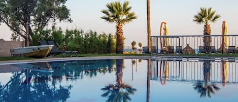 Indoor pool, outdoor pool, open 9:30 AM to 6:30 PM, pool umbrellas