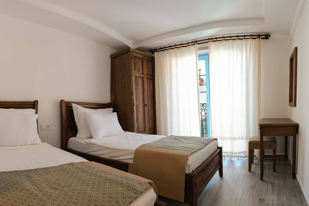 Minibar, desk, laptop workspace, blackout curtains