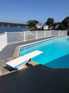 Relax by the pool with a clear view of the surrounding landscape.
