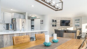 A modern kitchen with white cabinets, a stainless steel refrigerator, and a built-in microwave. - Park Pointe C201 - Community Pool/Hot tub (Chelan)
