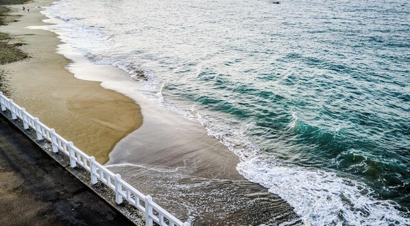 On the beach, sun loungers