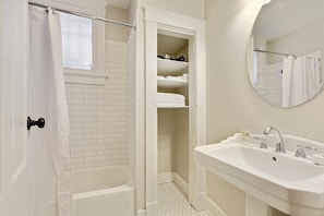 Combined shower/tub, hair dryer, towels, soap