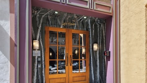 A wooden double door with glass panels, a sign above reading "Lift House," and two wall-mounted lights on either side. - Rooftop Hot Tub, Remodeled, Dog Friendly LH Premium (Vail)