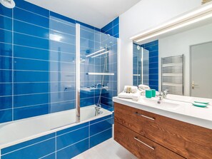 Bathtub, hair dryer, towels, soap