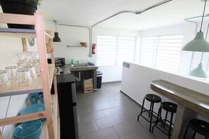 Fridge, microwave, stovetop, coffee/tea maker