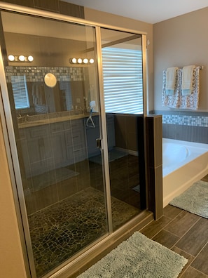 Combined shower/tub, hair dryer, towels, toilet paper