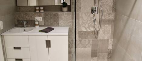 Shower, hair dryer, towels, soap