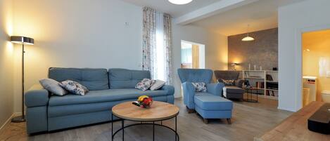 Superior Apartment | Living area | 65-inch Smart TV with satellite channels, TV, video-game console