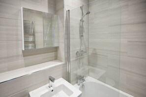 Combined shower/tub, hair dryer, towels, soap