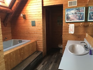 Bathtub, jetted bath, hair dryer, towels