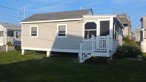 A single-story house with a front porch and a garage. - Breakwater Village, Coastal Cottage w/access to a private beach (Narragansett)