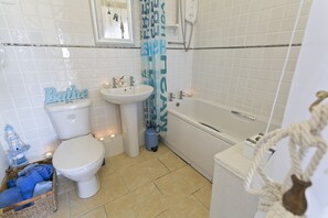 Combined shower/bathtub, hair dryer, towels, soap - Detached Cottage with Stunning Sea Views (Holyhead)