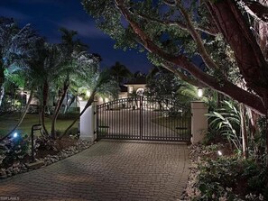 entrance to a serene garden oasis, complete with a tranquil water feature.