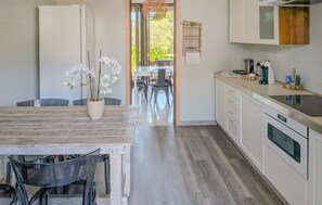 Fridge, stovetop, dishwasher, coffee/tea maker