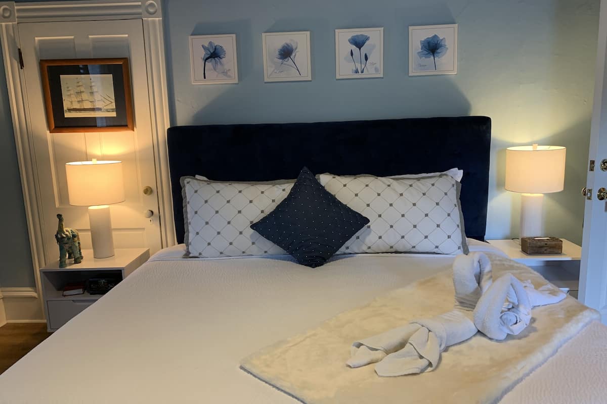 Luxury Suite, 1 King Bed, Balcony | 1 bedroom, down comforters, memory foam beds, individually decorated