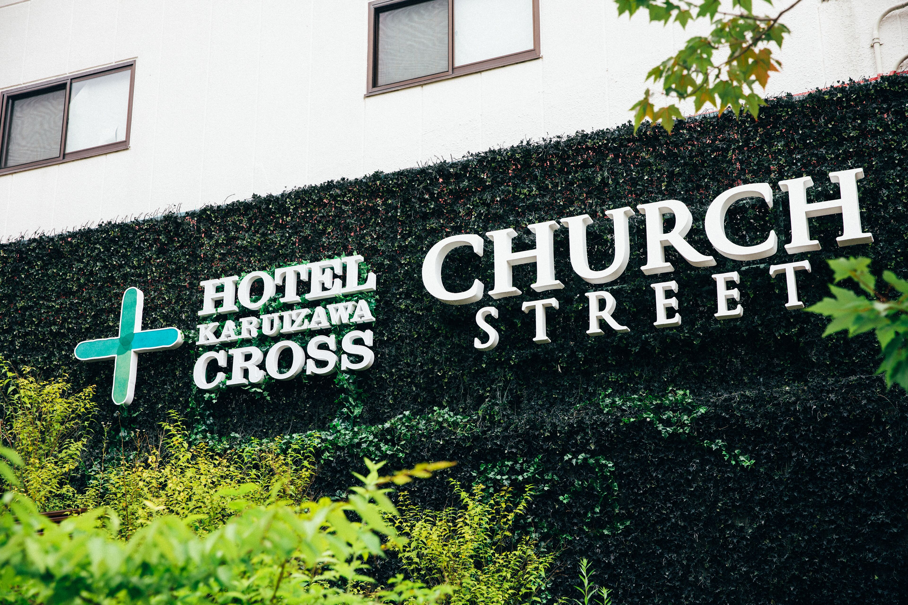 A sign for Hotel Karuzawa Cross Church Street.