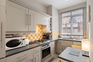 Apartment (1 Bedroom) | Private kitchen | Microwave, oven, stovetop, dishwasher