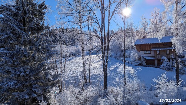A snow-covered landscape with a wooden cabin. - Apartment Combloux sleeps 4 at the foot of the slopes (Combloux)