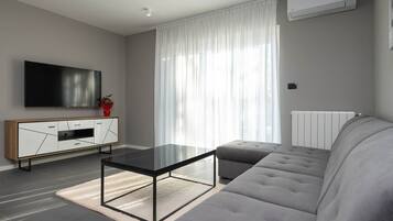 Villa | Living room | TV, fireplace