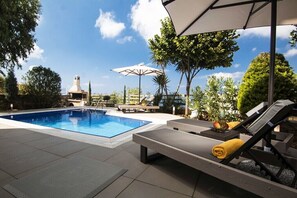 Seasonal outdoor pool, pool umbrellas, sun loungers