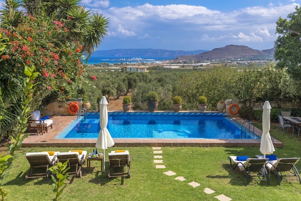 Seasonal outdoor pool, pool umbrellas, pool loungers