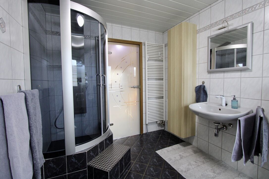 Bathtub, hair dryer, towels, soap