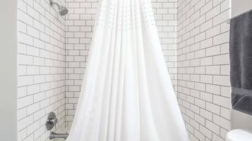 Bathtub, hair dryer, towels