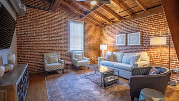 Studio Suite, 1 King Bed with Sofa bed | Living area | 55-inch Smart TV with cable channels, TV