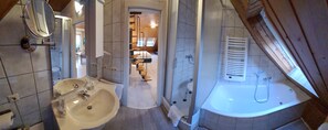 Bathtub, hair dryer, towels, soap