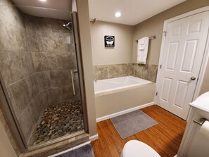 Combined shower/bathtub, hair dryer, towels, soap